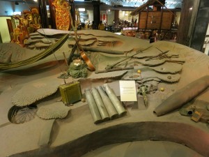 Inside the Ho Chi Minh museum. Artifacts from the war. Notice the pointy bomb next to the display sign. It was dropped by the US into the jungle, landed in the ground vertically. The top portion acted as a transmitter and would signal US forces when it picked up voices. The US would then know where to drop its bombs. Skilled Vietnamese soldiers didn't talk loudly.