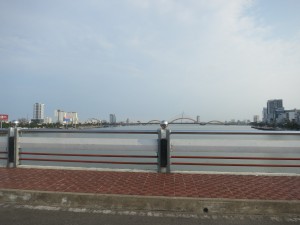 Driving across one of the many bridges in Danang, looking south. Notice the dragon bridge in the distance.