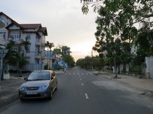 A typical street in Danang. Looking west, our hotel was up on the right. Behind us is the beach.