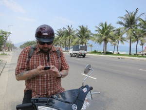 Da Nang highway next to the beach. Heading south toward the Marble Mountains on Yamaha scooters.